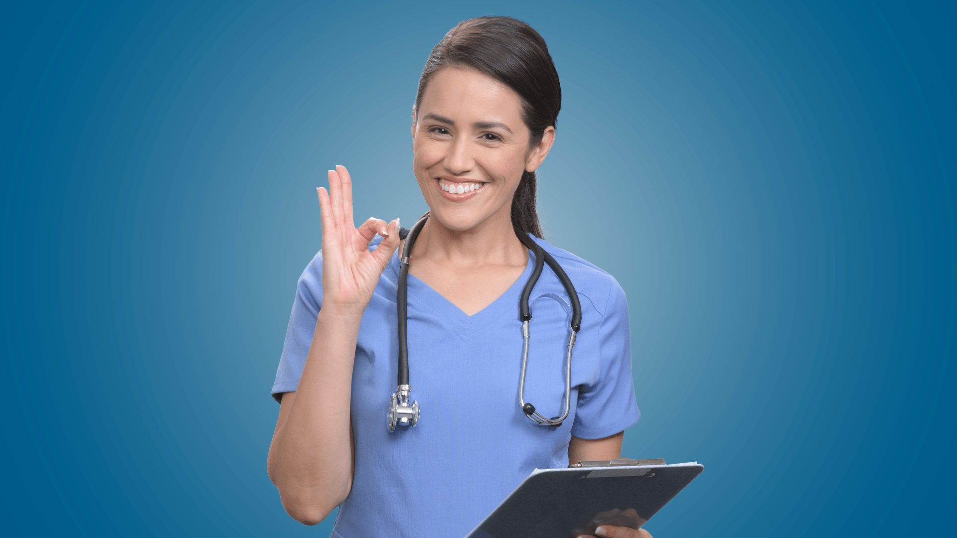 In Touch Pharmaceuticals brand photography. Nurse giving okay sign with hand while holding clipboard.